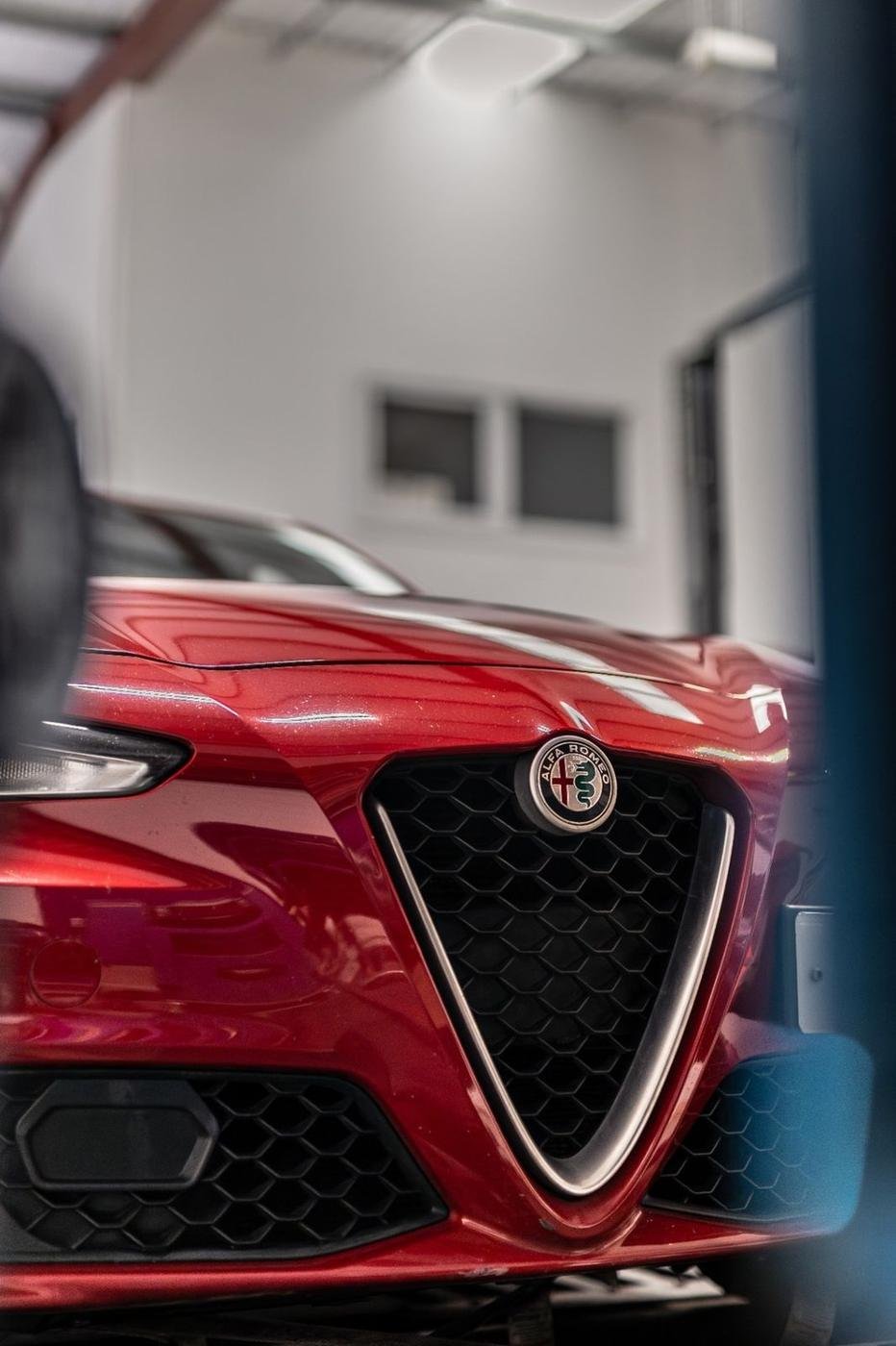 Red Alfa Romeo Giulia front grille detail