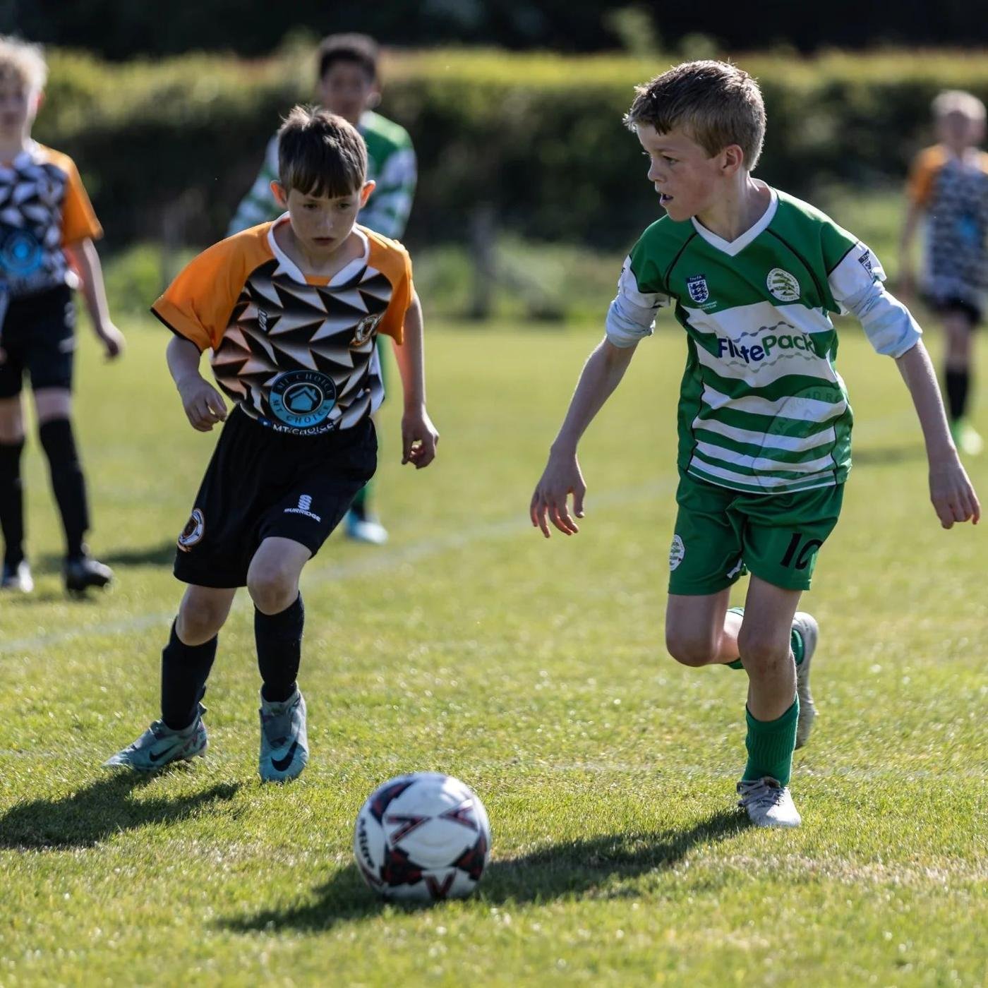 Junior football match in play